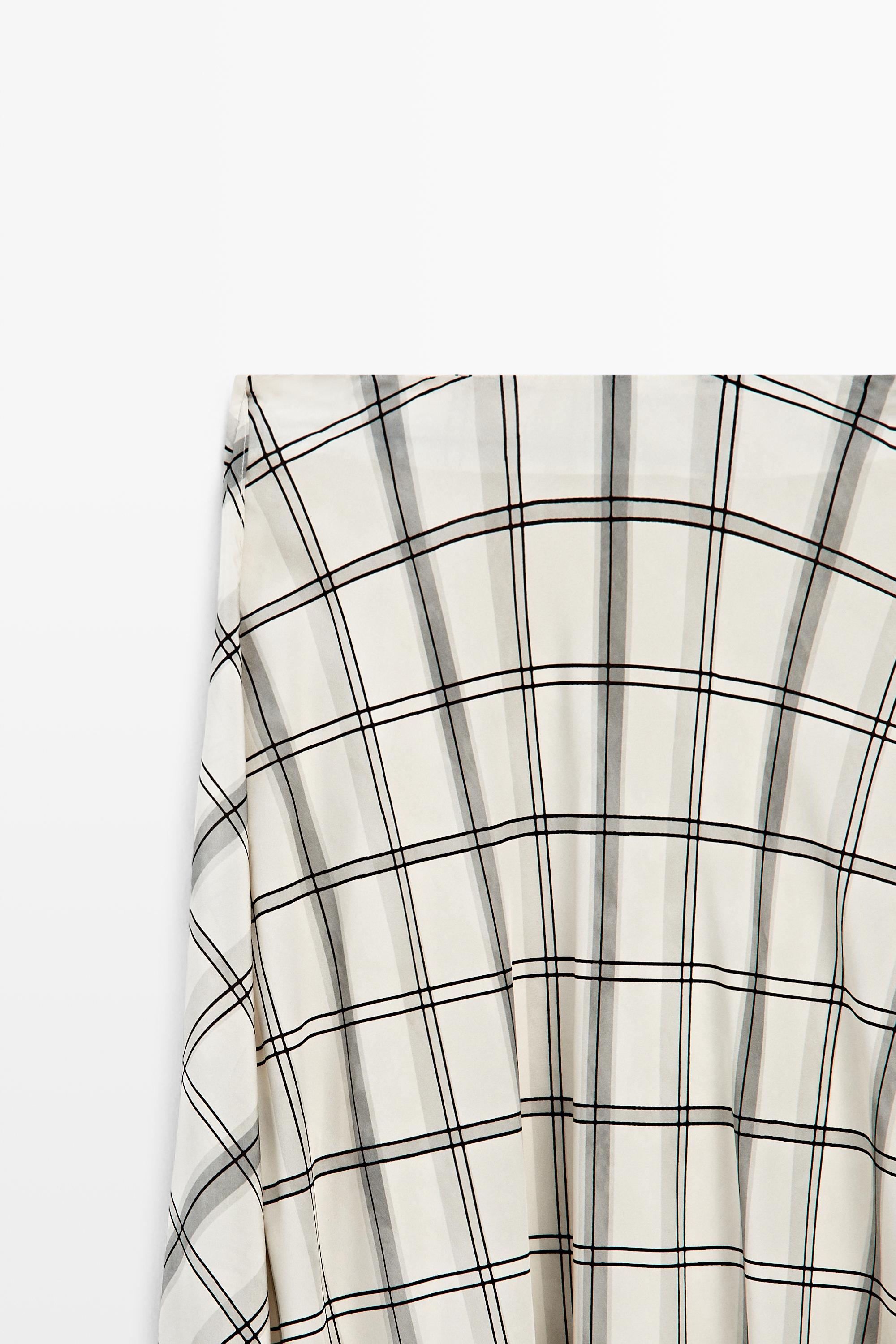Jupe midi asymétrique à détail carreaux